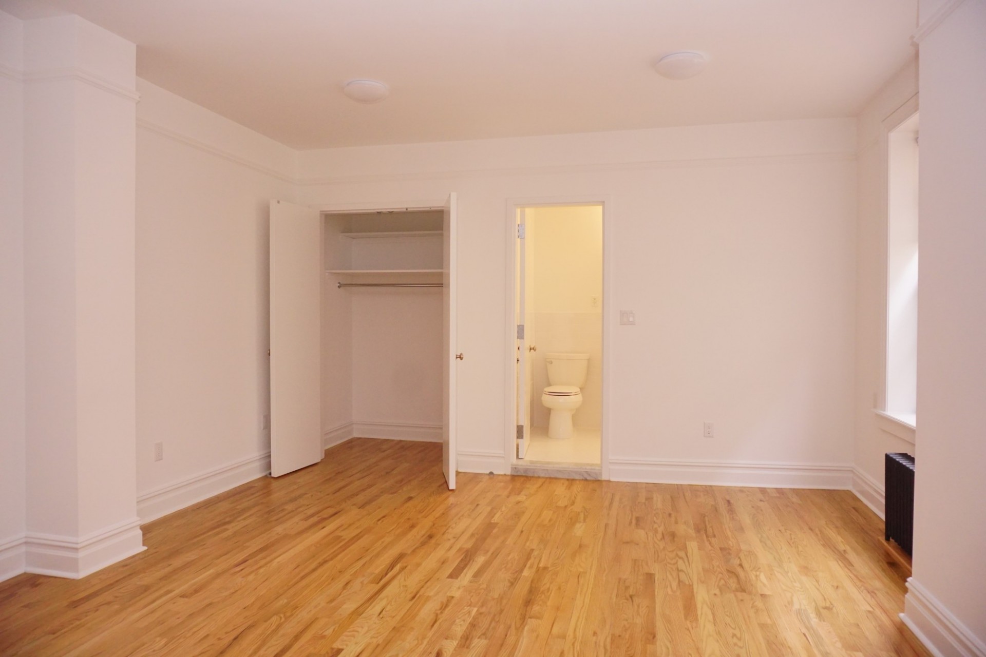 Example of studio apartment - living area and bathroom view