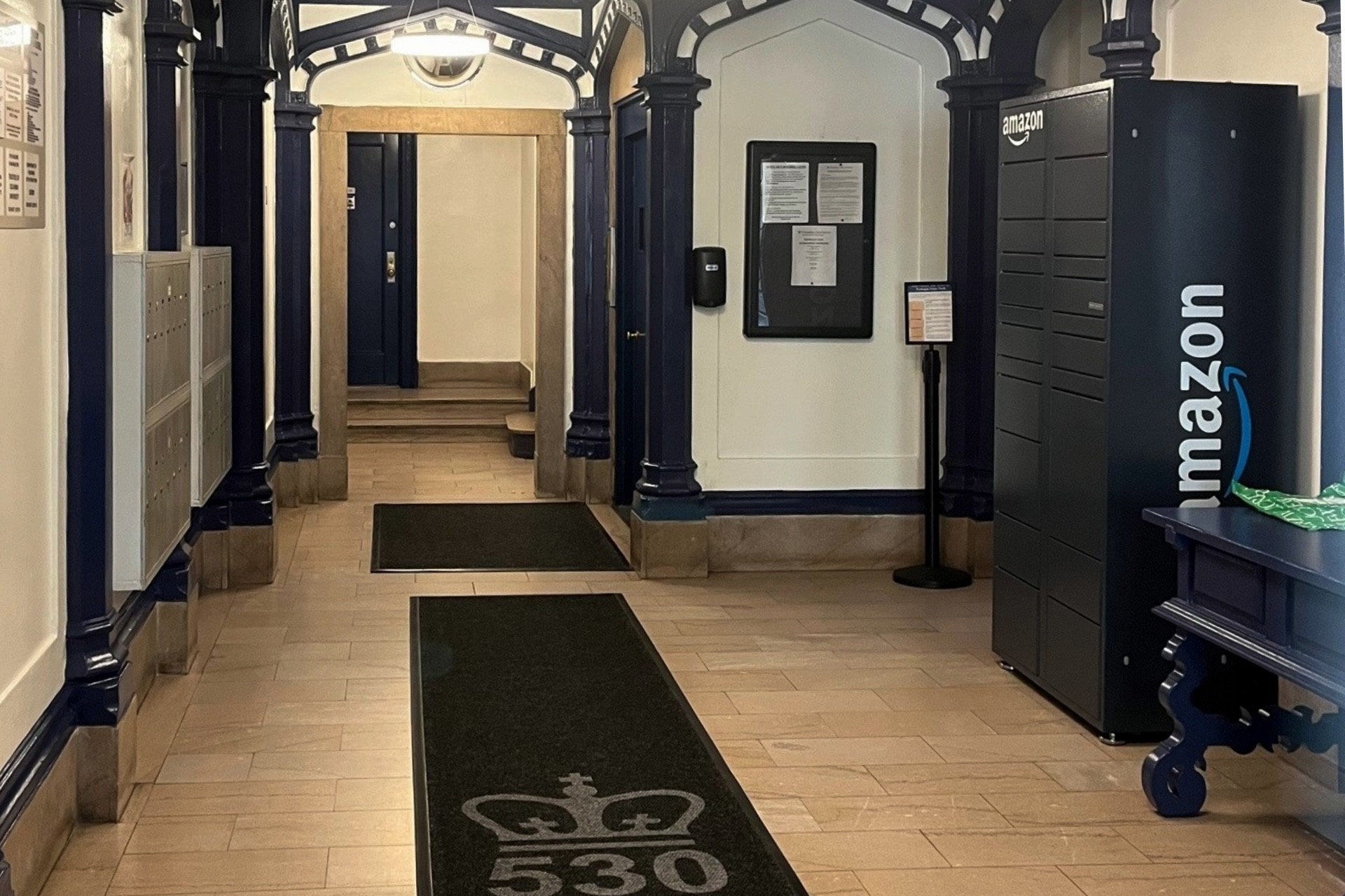 The lobby of 530 W. 113th St, an Amazon Locker is against the right wall