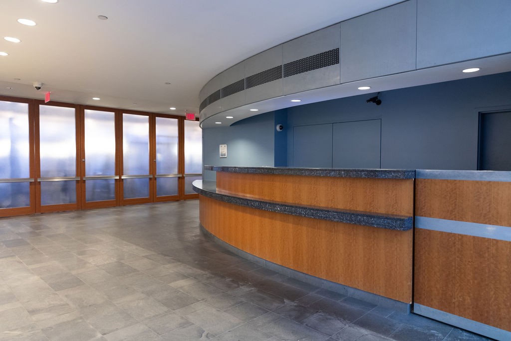 View of building lobby from entrance showing reception desk