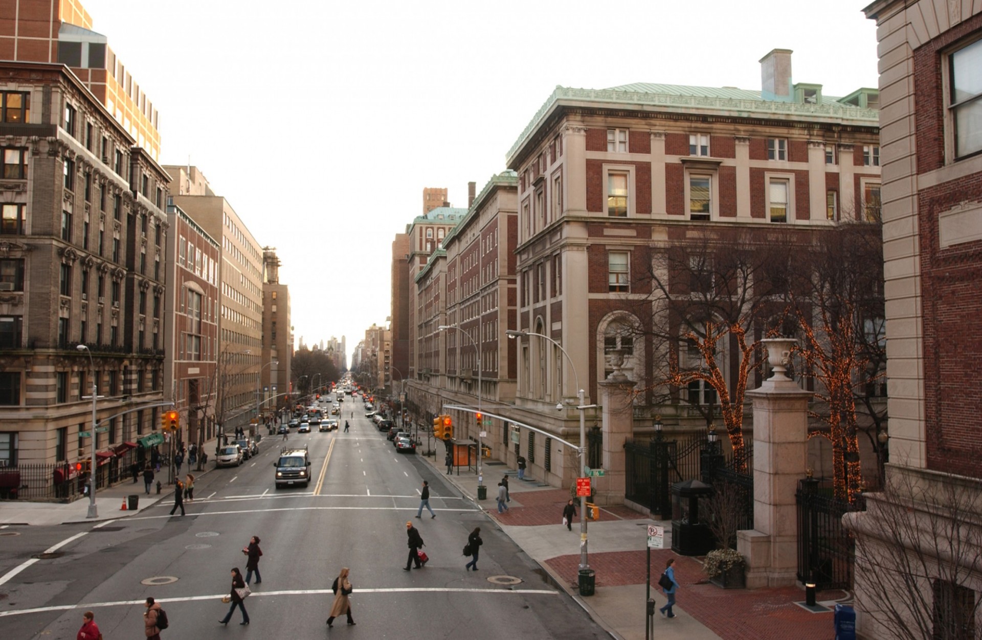 photo of Amsterdam Avenue and 116th Street looking downtown, with the campus gates on the right and residential building on the left