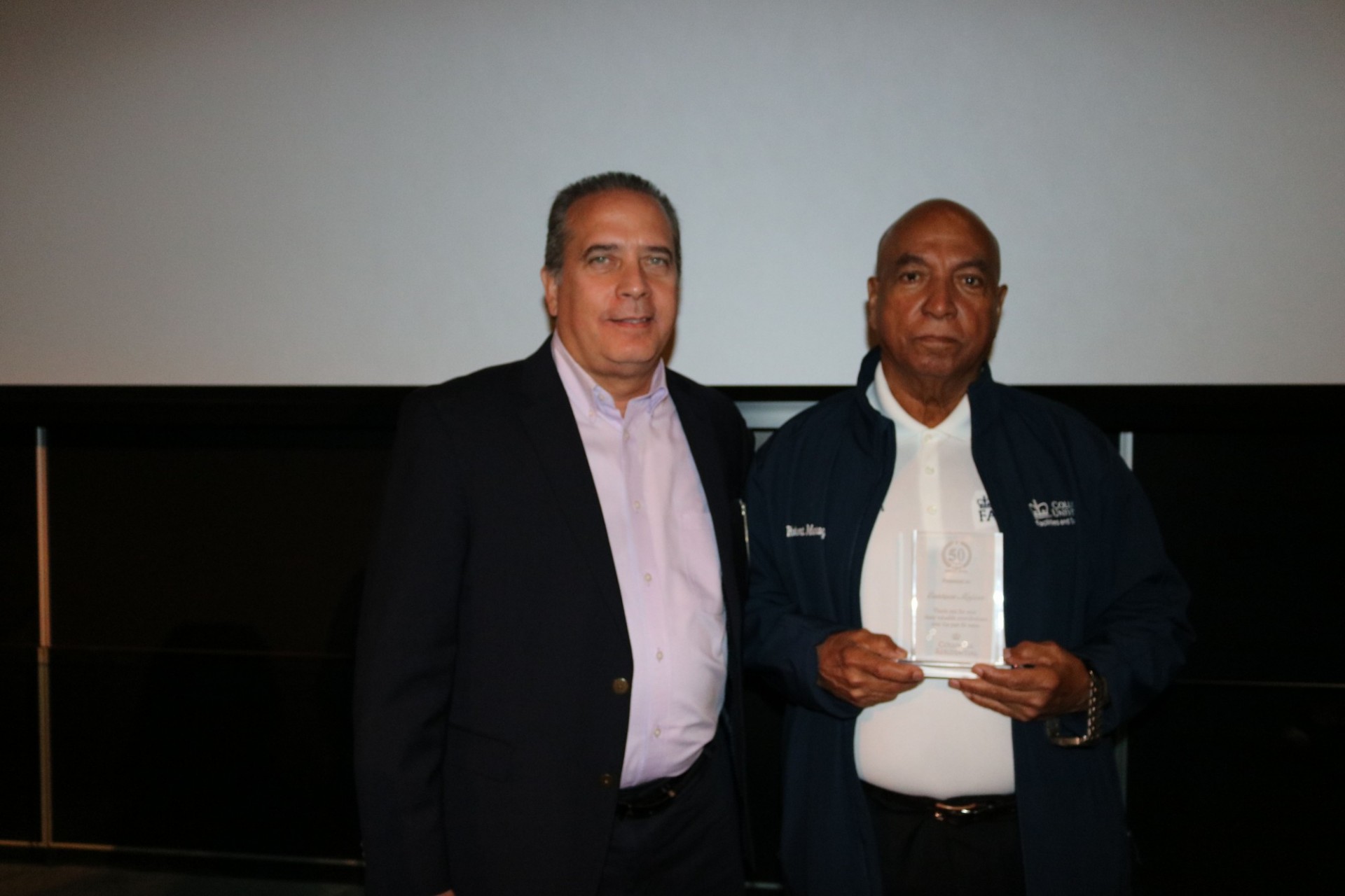 Resident Manager Eustace Mejias was recognized for his incredible dedication to the team for more than five decades. Nelson Falcon and Resident Manager Eustace Mejias