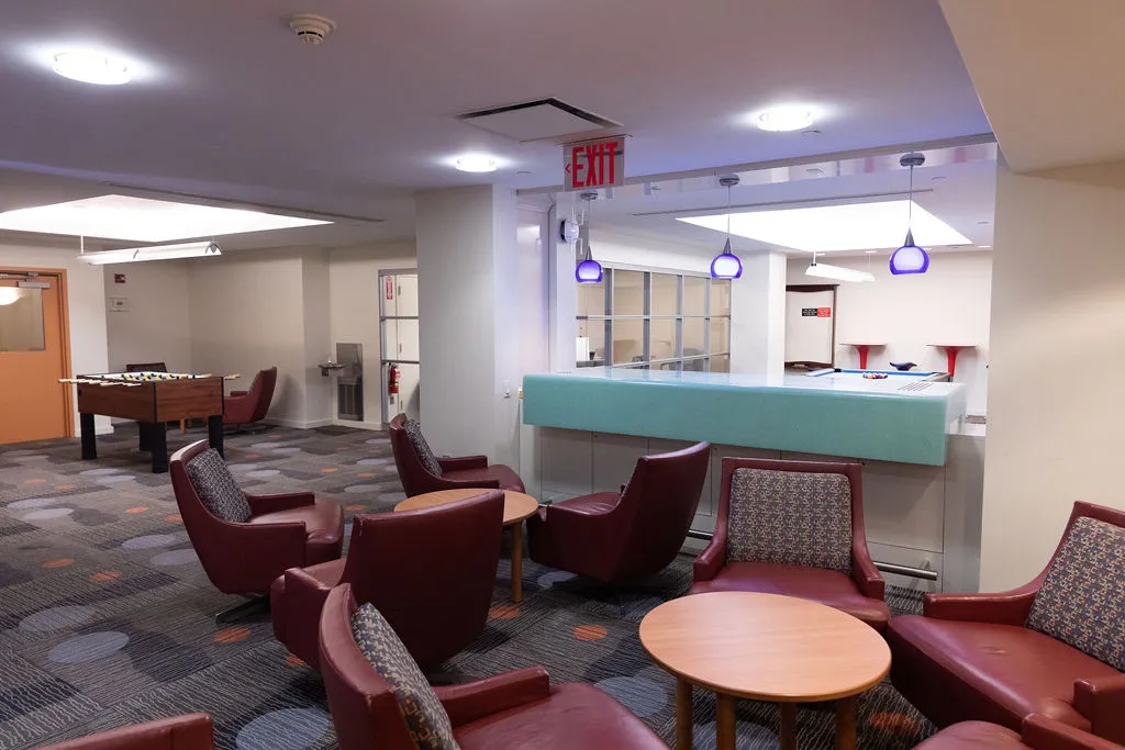 View of building lounge showing lounge seating and foosball table