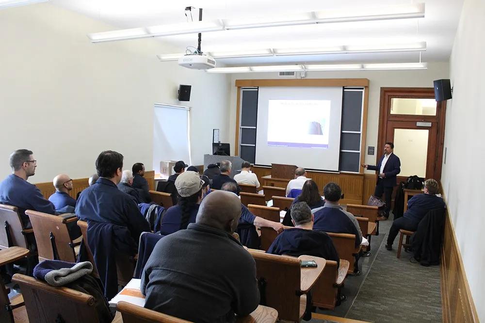 Building superintendents and resident managers sit in a classroom during a safety training session.