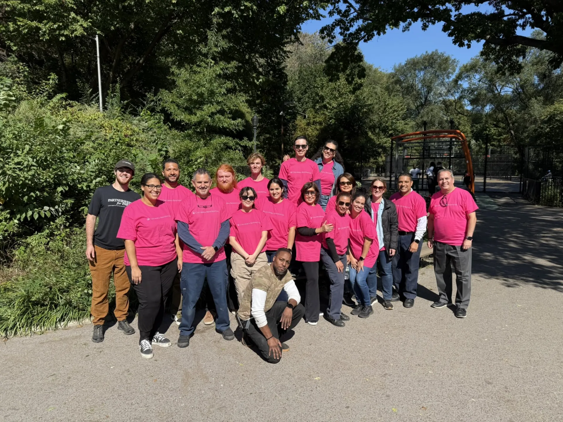 Columbia Residential team posing for a group photo in Morningside Park